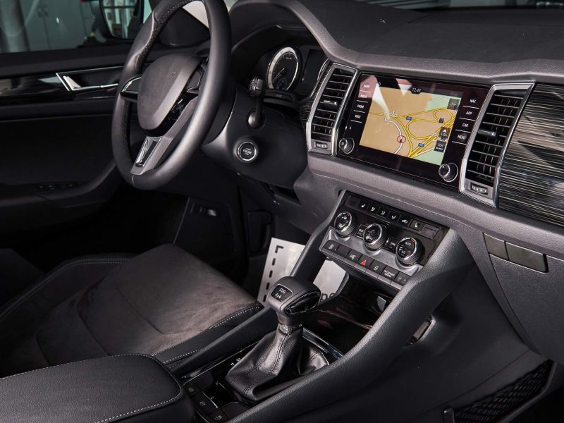 luxury-car-interior-steering-wheel-shift-lever-and-dashboard.jpg