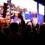 silhouette-using-mobile-phone-concert